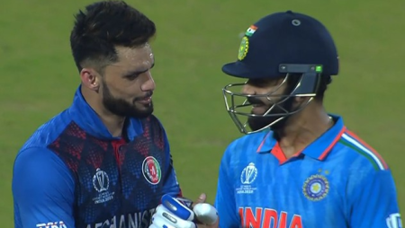 Virat Kohli and Naveen-ul-Haq exchange smiles at the Arun Jaitley