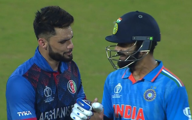 Virat Kohli and Naveen-ul-Haq exchange smiles at the Arun Jaitley