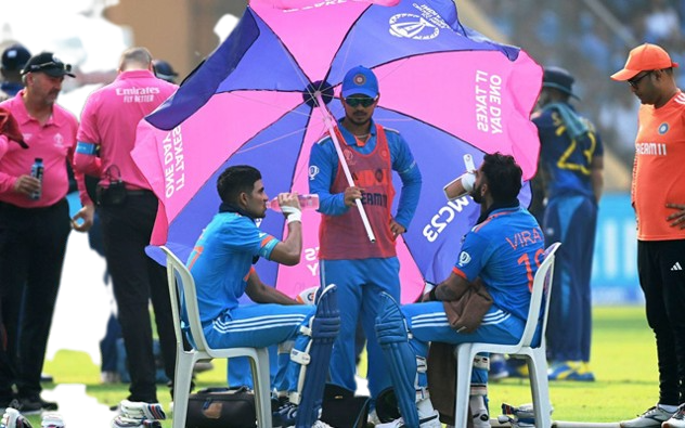 Ishan Kishan’s brilliant umbrella trick shields Kohli and Gill from the scorching heat of Mumbai.